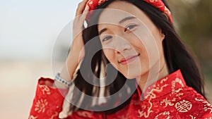 Vietnam girl in the national costume and dress Ao Dai posing and smiling for the camera