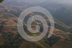 Vietnam landscape with rice field, river, mountain and low clouds in early foggy morning in Trung Khanh, Cao Bang, Vietnam