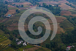 Vietnam landscape with rice field, river, mountain and low clouds in early foggy morning in Trung Khanh, Cao Bang, Vietnam