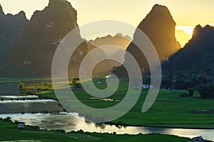 Vietnam landscape with rice field, river, mountain and low clouds in early morning in Trung Khanh, Cao Bang, Vietnam