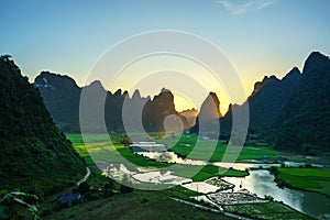 Vietnam landscape with rice field, river, mountain and low clouds in early morning in Trung Khanh, Cao Bang, Vietnam