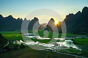 Vietnam landscape with rice field, river, mountain and low clouds in early morning in Trung Khanh, Cao Bang, Vietnam