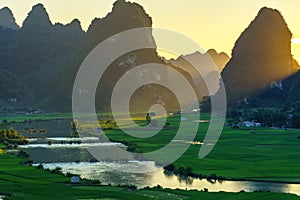 Vietnam landscape with rice field, river, mountain and low clouds in early morning in Trung Khanh, Cao Bang, Vietnam