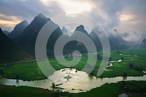 Vietnam landscape with rice field, river, mountain and low clouds in early morning in Trung Khanh, Cao Bang, Vietnam