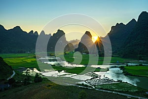 Vietnam landscape with rice field, river, mountain and low clouds in early morning in Trung Khanh, Cao Bang, Vietnam