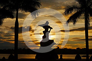 Vietnam Me Suot statue silhouette near a Nhat Le River