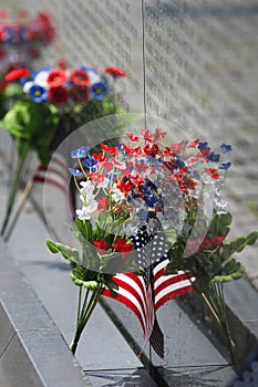 VIETNAM WALL MEOMORIAL FLAG AND FLOWERS