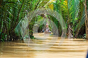 Vietnamese boatman in the Mekong Delta