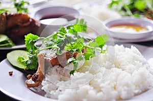 Vietnamese broken rice or com tam with fried chicken legs, pork