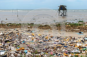 Vietnamese coastline covered in trash and garbage photo