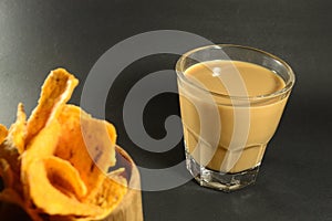 Vietnamese coffee drip on wooden planks with black background