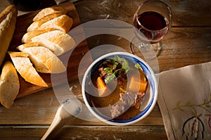 Vietnamese cuising beef stew with bread and red wine