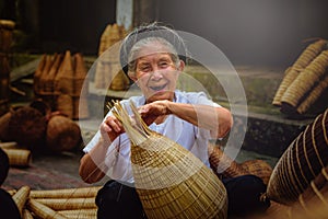 Vietnamese fishermen are doing basketry for fishing equipment at