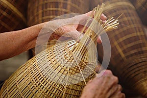 Vietnamese fishermen are doing basketry for fishing equipment