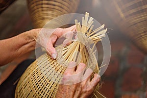 Vietnamese fishermen are doing basketry for fishing equipment at