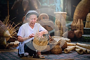 Vietnamese fishermen are doing basketry for fishing equipment at