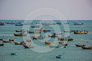 Vietnamese fishing village with traditional colorful fishing bo