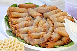 Vietnamese food fry spring rolls display on the leaf close up