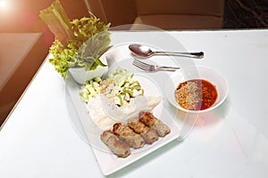 Vietnamese Food in Restaurant white plate on the Table with side dish, Ingredients of Vietnamese Wraps or Pork Sausage, Nam Naung