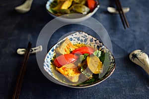 Vietnamese fried eggplant with tomato on the table