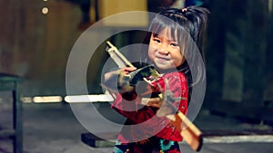 Vietnamese girl carrying firewood in Sa Pa valley photo