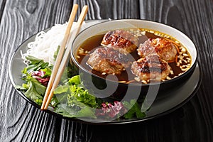 Vietnamese Grilled Pork Meatballs with Vermicelli Noodles Bun Cha is a classic Northern Vietnamese dish closeup in the plate.