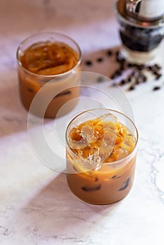 Vietnamese iced coffee, brewing with sweet condensed milk in glass
