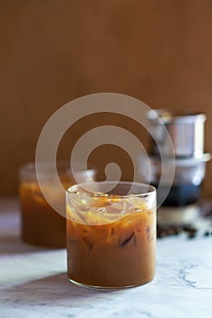 Vietnamese iced coffee, brewing with sweet condensed milk in glass