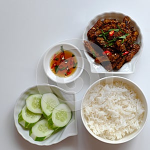 Vietnamese meal for lunch, vegetarian homemade food with seitan, vegetable soup, rice dish