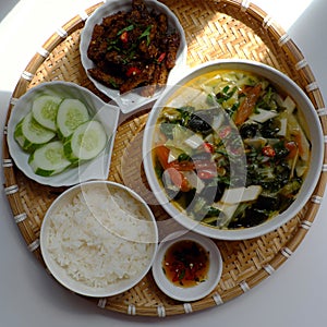 Vietnamese meal for lunch, vegetarian homemade food with seitan, vegetable soup, rice dish