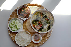 Vietnamese meal for lunch, vegetarian homemade food with seitan, vegetable soup, rice dish