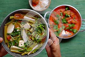 Vietnamese meal for lunch, vegetarian homemade food, tofu ball cook with tomato sauce, vegetable soup, rice bowl