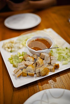 Vietnamese Meatball Wraps in white plate on wood table photo