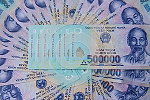 Vietnamese money on white table. Just printed asian money. Asian money fan out. Concept of rich and sucsess.