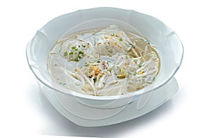 Vietnamese noodle soup with pork in a bowl.