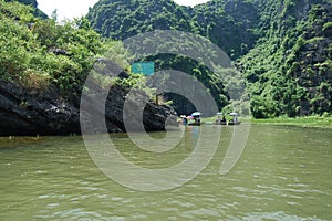 Vietnamese people and foreign traveler travel visit and amazing boat tour trip Tam Coc Bich Dong or Halong Bay on Land and Ngo