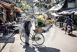 Vietnamese people often use cargo bikes to sell their goods on the streets of Hanoi, Vietnam.