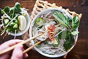 Vietnamese pho with spicy sriracha sauce