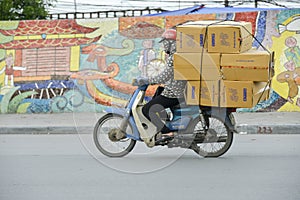 Vietnamese sales man on his motorbike