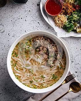 Vietnamese soup Pho Bo, top view, upright