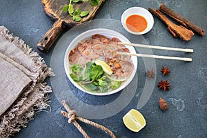 Vietnamese soup on a textured table