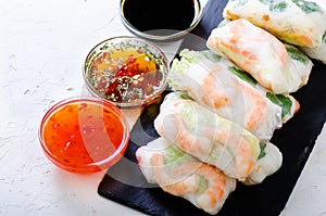 Vietnamese spring rolls - rice paper, lettuce, salad, vermicelli, noodles, shrimps, fish sauce, sweet chili, soy, lemon