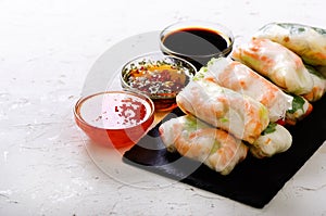 Vietnamese spring rolls - rice paper, lettuce, salad, vermicelli, noodles, shrimps, fish sauce, sweet chili, soy, lemon