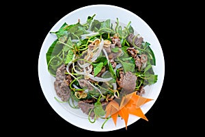 Vietnamese stir fried chayote with beef isolated on black background