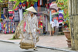 Vietnamese street vendor in Hoi An