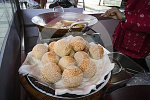 Vietnamese traditional Orange Cake, fried ball of glutinous rice dough filled with grind sweet mung bean