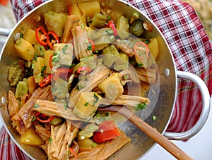 Vietnamese vegan food for vegetarian, tofu skin, pine apple and bitter melon cook with sauce