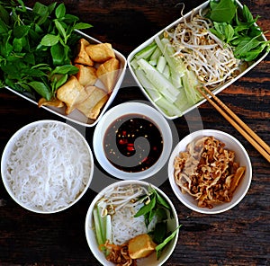 Vietnamese vegan meal for quick lunch time with homemade food, rice vermicelli soft noodles and fried tofu