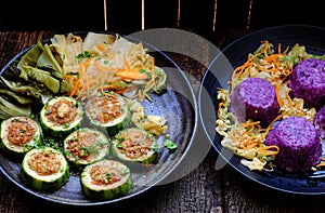 Vietnamese vegetarian eating, grilled vegetables, winter melon stuff with tofu, carrot, violet rice dish