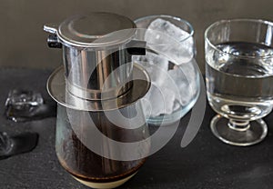 Vietnamese way of brewing coffee using a special filter - phin.